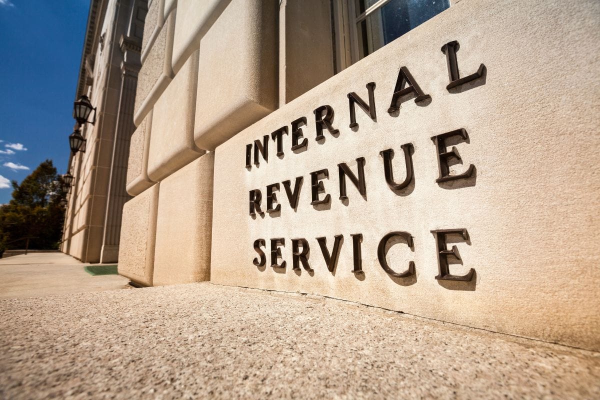 The irs sign is in front of a building.